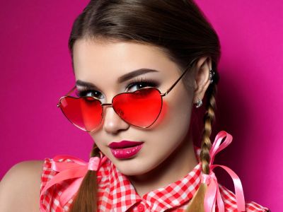young-woman-looks-over-heart-shaped-glasses-2021-08-26-22-25-41-utc.jpg