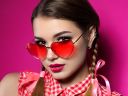 young-woman-looks-over-heart-shaped-glasses-2021-08-26-22-25-41-utc.jpg